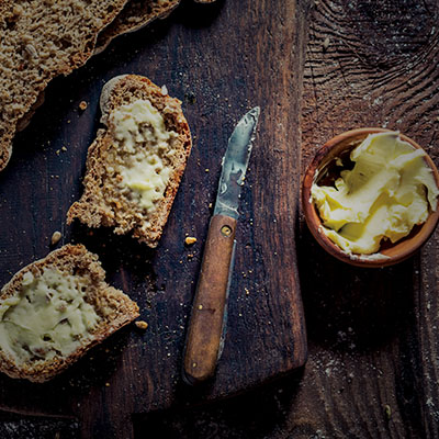 Butter on slices of sourdough bread